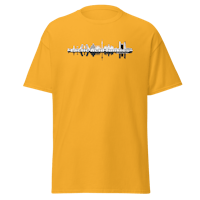 a yellow t - shirt with an image of a city skyline