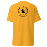 a yellow t - shirt with a bear paw on it